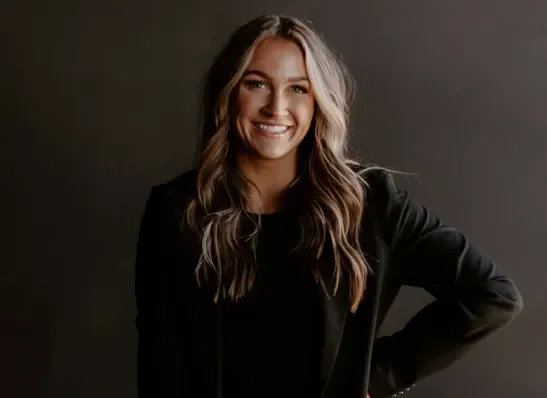 Aubrey, Vow and Order’s founder, smiling in a black blazer